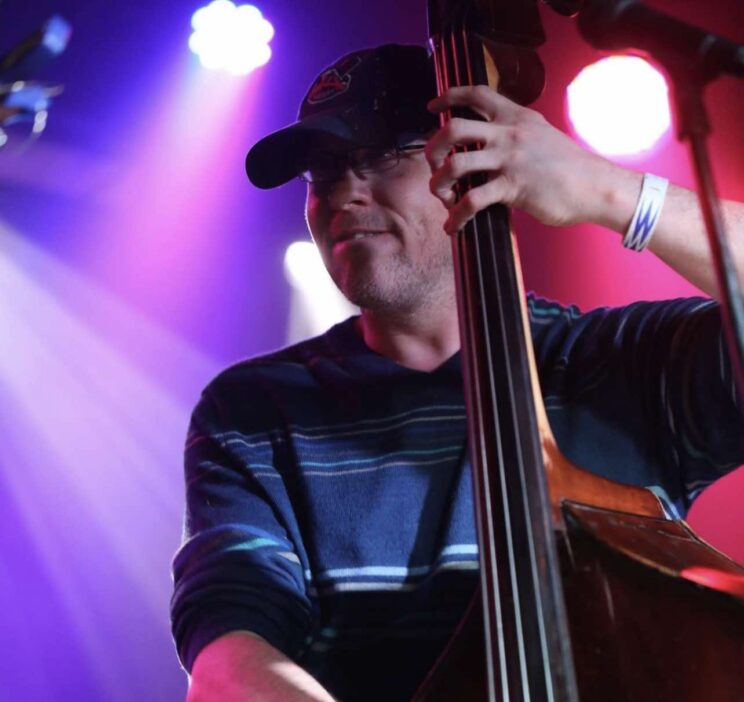 Greg Thurman playing bass on stage