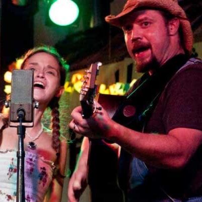 Trae and Jamie singing outdoors