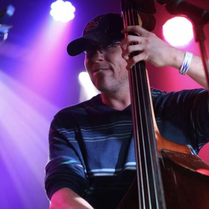 Greg Thurman playing bass on stage